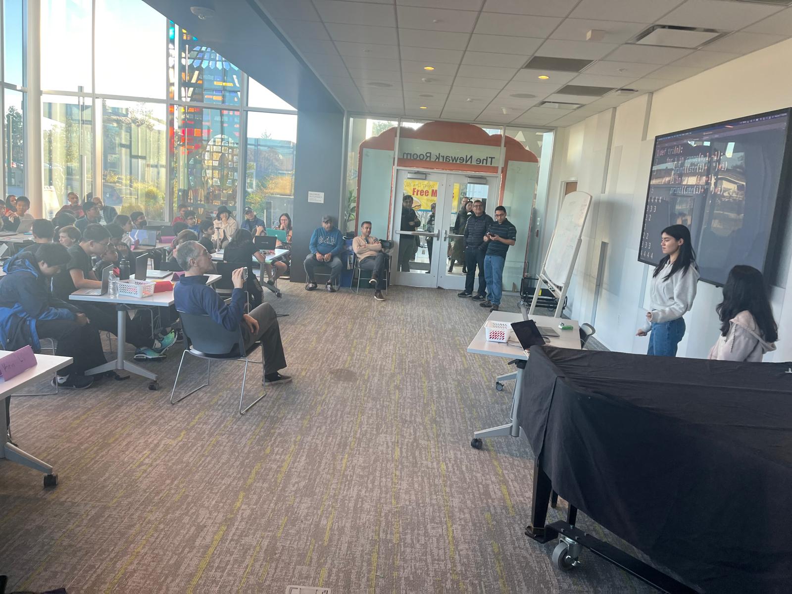 Students presenting solutions